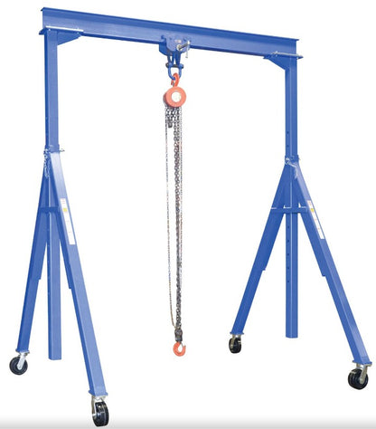 Portable adjustable steel gantry crane by Vestil with manual chain hoist and I-beam design for heavy-duty lifting.