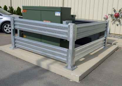 Galvanized Guard Rail from Vestil, drop-in and bolt-on style, used for safety guarding around electrical boxes outdoors.