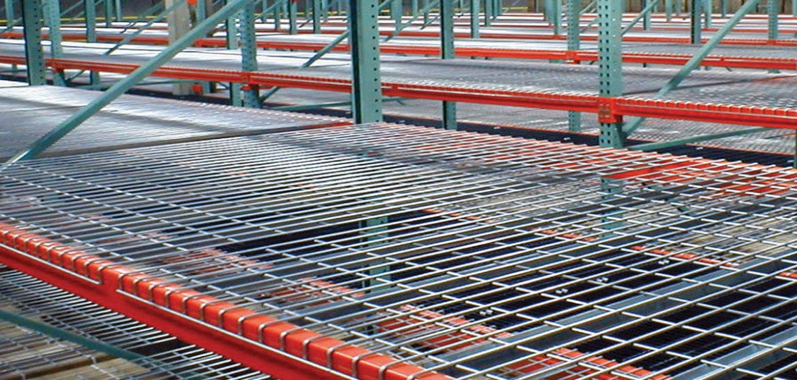 Light gray powder-coated wire decking for pallet rack system by TACT Industrial Products, showing durable metal construction.